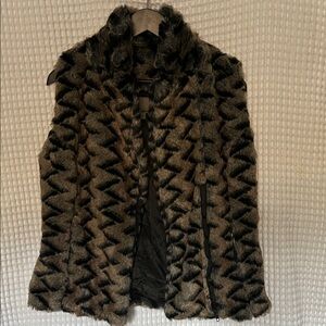 Women's Faux Fur Vest in Black and Brown.  zipper front, zipper side pockets.